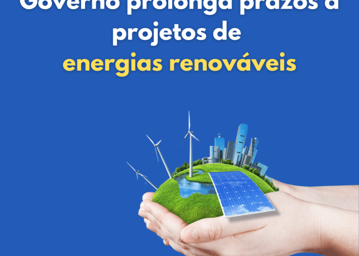 Mãos seguram cidade sustentável com painéis fotovoltaicos com o texto Governo prolonga prazos a projetos de energias renováveis